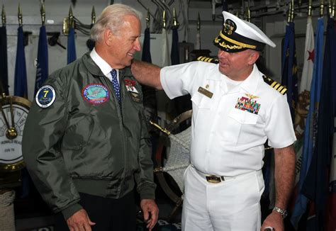 Vice President Joe Biden Receives A Flight Jacket From The Commanding Offficer Of The Uss Ronald
