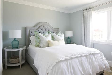 Having a bedroom nightstand is a must. Gray Tufted Bed with Round Whitewashed Nightstands with ...
