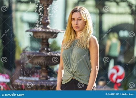 A Lovely Blonde Model Enjoys An Autumn Day Outdoors In A Small Town Stock Image Image Of
