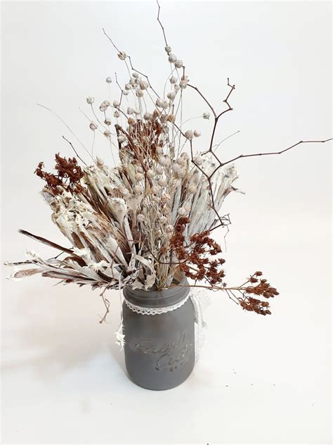 Or if you've got more time, you could paint them. Jessica-Dried flowers in a gray glass mason jar ...