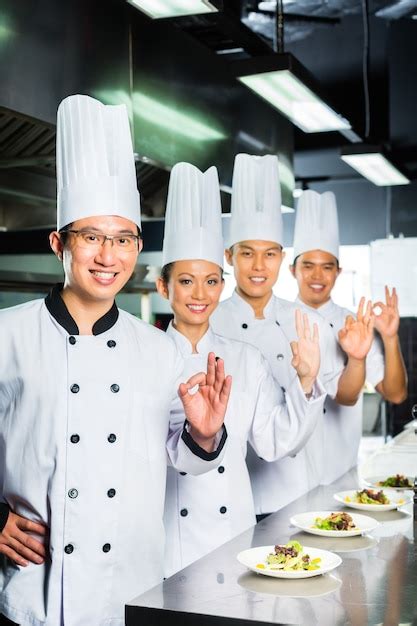 premium photo asian chef in restaurant kitchen cooking