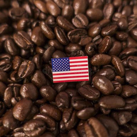 A United States Flag Placed Over Roasted Coffee Beans Stock Photo