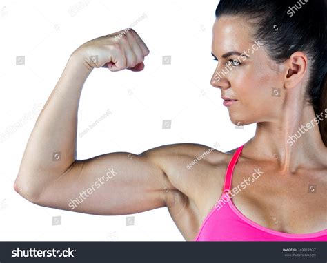 Strong Woman Athlete Showing Her Muscular Stock Photo