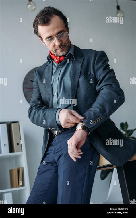 Businessman Checking Wristwatch Stock Photo Alamy