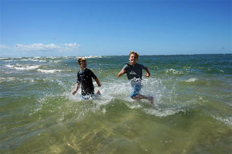 My Sons Julian And Keiran Running And Splashing In The Ocean Roxanne