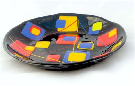 fused glass bowl in black with primary color accents 11 5 inches in diameter perfect for