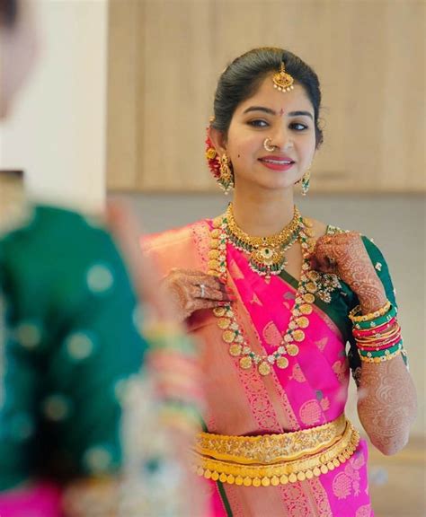 A Telugu Bride With Traditional Pink Kanjeevaram Saree And Antique