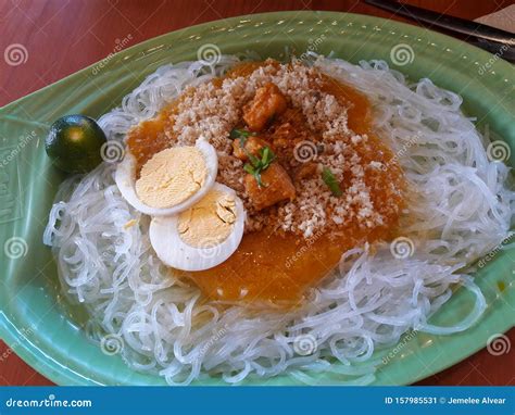 Filipino Dish Pancit Palabok Is A White Noodle With Eggs And Meat