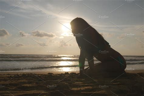Beautiful Young Woman In Bikini Lying On Golden Sand On Sea Beach And