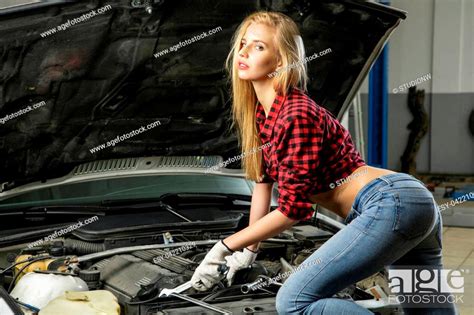 Beautiful Girl Mechanic Repairing A Car Working With Engine Stock