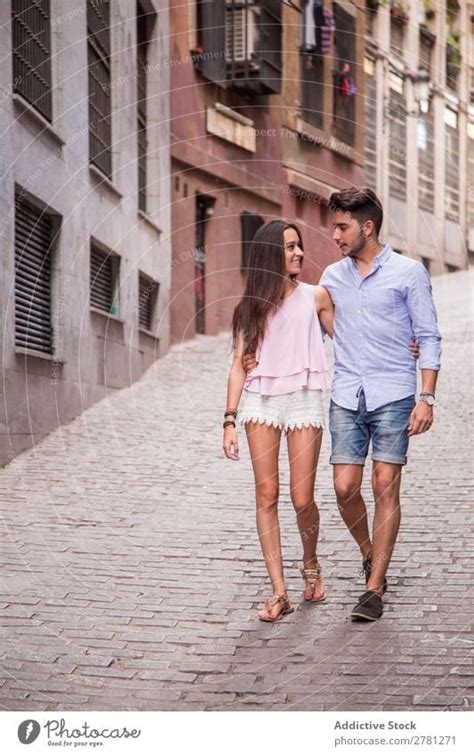 Happy Couple Walking On Street A Royalty Free Stock Photo From Photocase