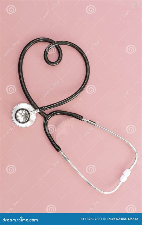 Stethoscope In The Shape Of Heart On Pink Background Stock Image