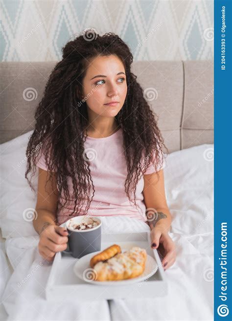 Woman Have Breakfast In Bed In Light Hotel Apartment Or At Home Window