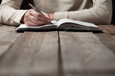 Hand Writes With A Pen In A Notebook Stock Photo By ©4masik 77851166