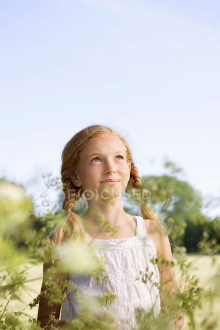 Portrait Of Young Girl With Flowers — Posing Teen Stock Photo