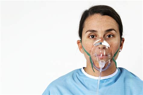 Sick Female Patient With An Oxygen Mask