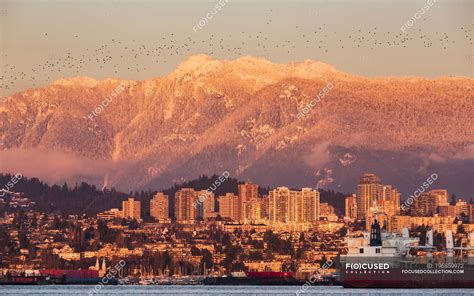 The North Vancouver Skyline And Coast Mountains Glowing At Dusk And