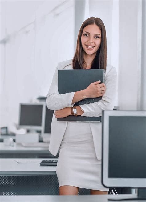 Female Assistant With Documents Standing In The Officephoto With Copy