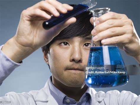 Scientist Holding Test Tubes High Res Stock Photo Getty Images