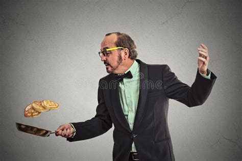 Smiling Man Tossing Pancakes On Frying Pan Stock Photo Image Of Funny