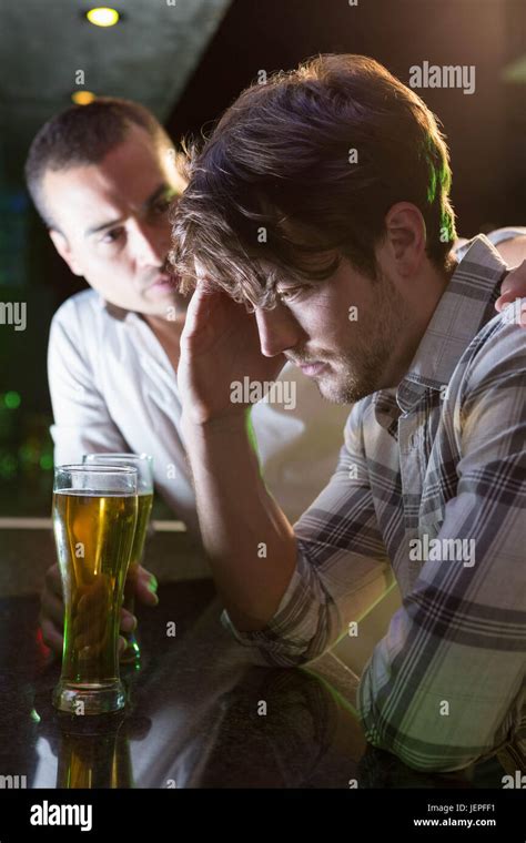Man Comforting His Depressed Friend Stock Photo Alamy