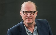 Comedian Adrian Edmondson rescued after getting stuck on window ledge