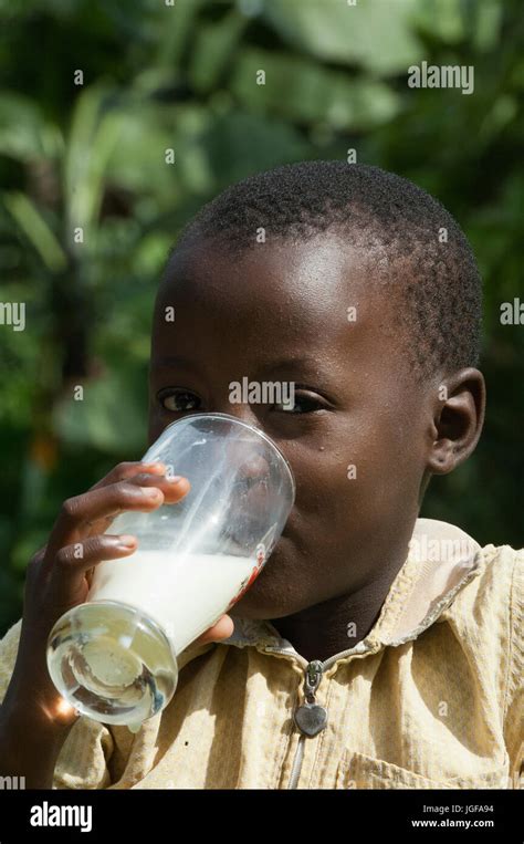 Happy Child Drinking A Glass Of Milk Rwanda Stock Photo Alamy