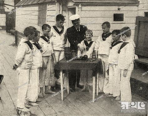 Barefoot Boys In Naval Style Uniforms Attend A Wireless Class Aboard