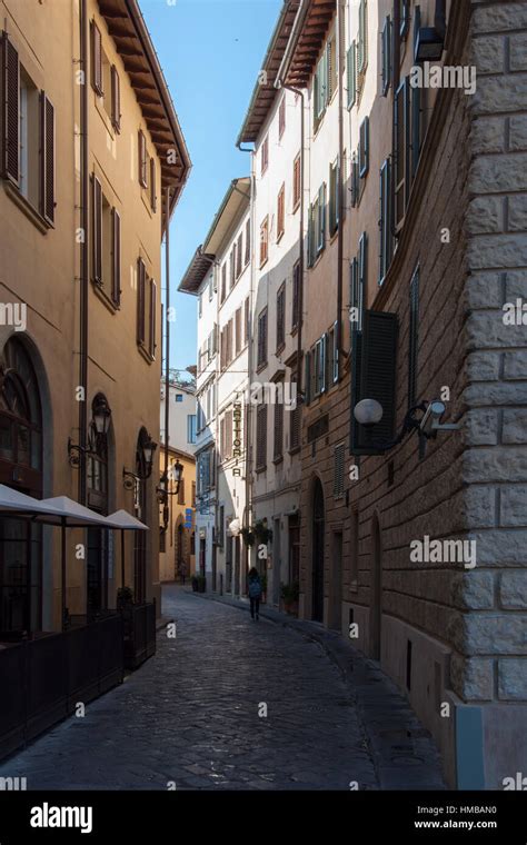 Narrow Cobblestone Street And Old Traditional Buildings In Florence