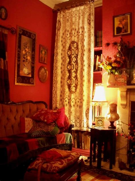 We know that the victorian era was all about the darker gold colors and the scroll work it features a gorgeous painting of the ocean and some houses. red room with bookcase hidden behind a curtain | Victorian rooms, Red rooms, Minimalist living ...