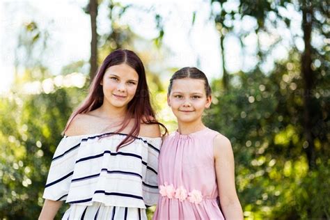 Image Of Portrait Of Tween Sisters With Natural Outdoor Background Austockphoto