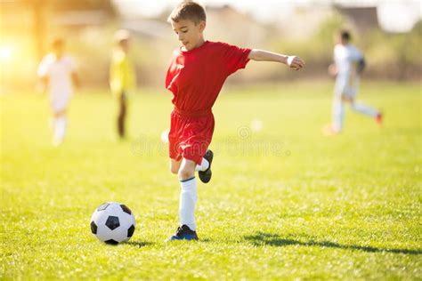 Kids Soccer Football Children Players Match On Soccer Field Stock