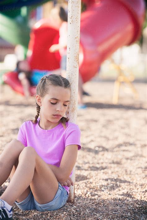 Recess Girls Sits On Playground By Herself Del Colaborador De Stocksy Sean Locke Stocksy