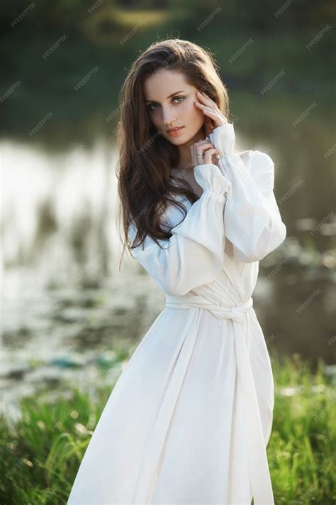 Premium Photo Beautiful Slender Woman In A Long White Dress Walks In