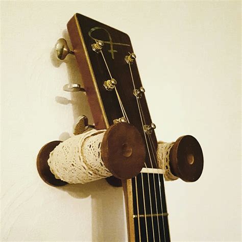 Guitar holder wall mount bracket guitar wall hanger wood hanging rack with pick holder and 3 hook carbonized timothymusicart 5 out of 5 stars (2) $ 49.99 free. DIY shabby vintage Guitar holder hook hanger wall mount ...