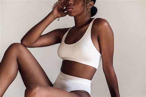Black Woman In White Underwear By Stocksy Contributor Lucas Ottone