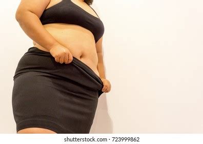 Overweight Woman Trying Fasten Her Skirt Stock Photo Edit Now