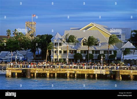 People Watching Leaving Cruise Ship On Crowded Key West Pier At Sunset