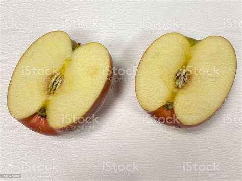 Photo Of Apple Sliced In Half Stock Photo Download Image Now Food