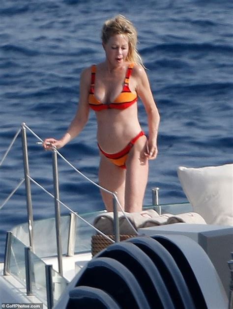 Melanie Griffith 61 Sizzles In An Orange Striped Bikini Aboard Luxury