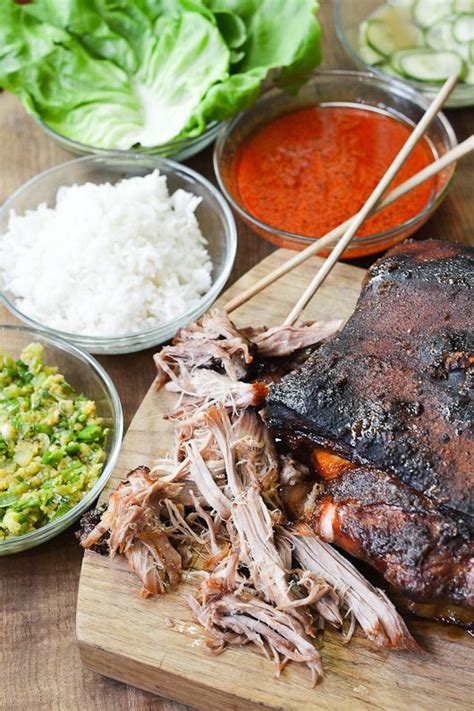 This slow roast pork shoulder cooks for 6 hours, for juicy meat and perfect pork crackling. Bo Ssam, Momofuku Style | Slow roasted pork shoulder, Pork shoulder recipes, Food