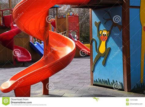 Red Kids Slide In A Playground Stock Photo Image Of Monkey Swing