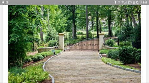 Pin By Florence Ralph On Gates And Fences Driveway Landscaping