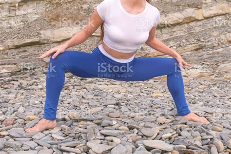 Girl Is Doing Plie Squats The Bodyflex During Breathing Exercises On