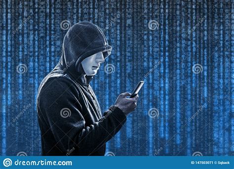 Hooded Hacker With Mask Holding Smartphone Stock Image Image Of Hood