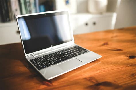 Opened Laptop Computer On A Wooden Desk · Free Stock Photo