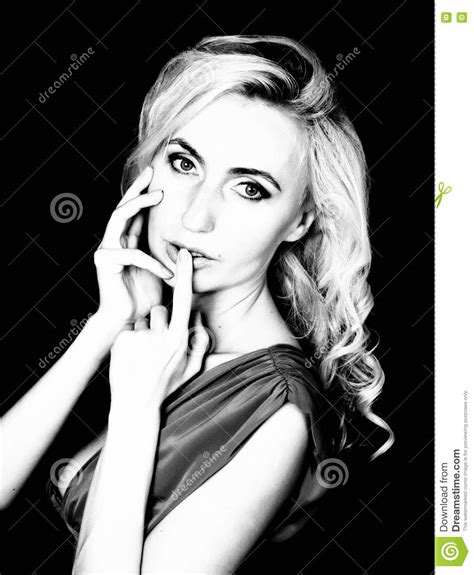 Close Up Lips Of Seductive Blonde Girl Raising Finger To Her Mouth Let It Be Our Secret Stock