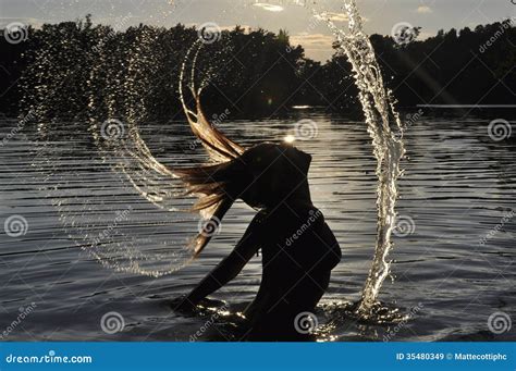 Model Splashing Water With Her Hair At Sunset Stock Image Image Of