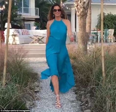 Cindy Crawford Wears Cerulean Blue Gown While Shooting Commercial In