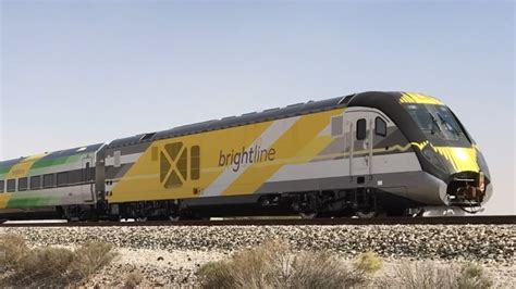 Florida Brightline High Speed Commuter Train And Military Train On The